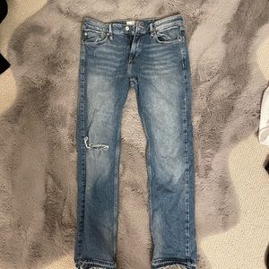 We the Free by Free People blue Jeans. Size 28. Relaxed distressed style fit.
